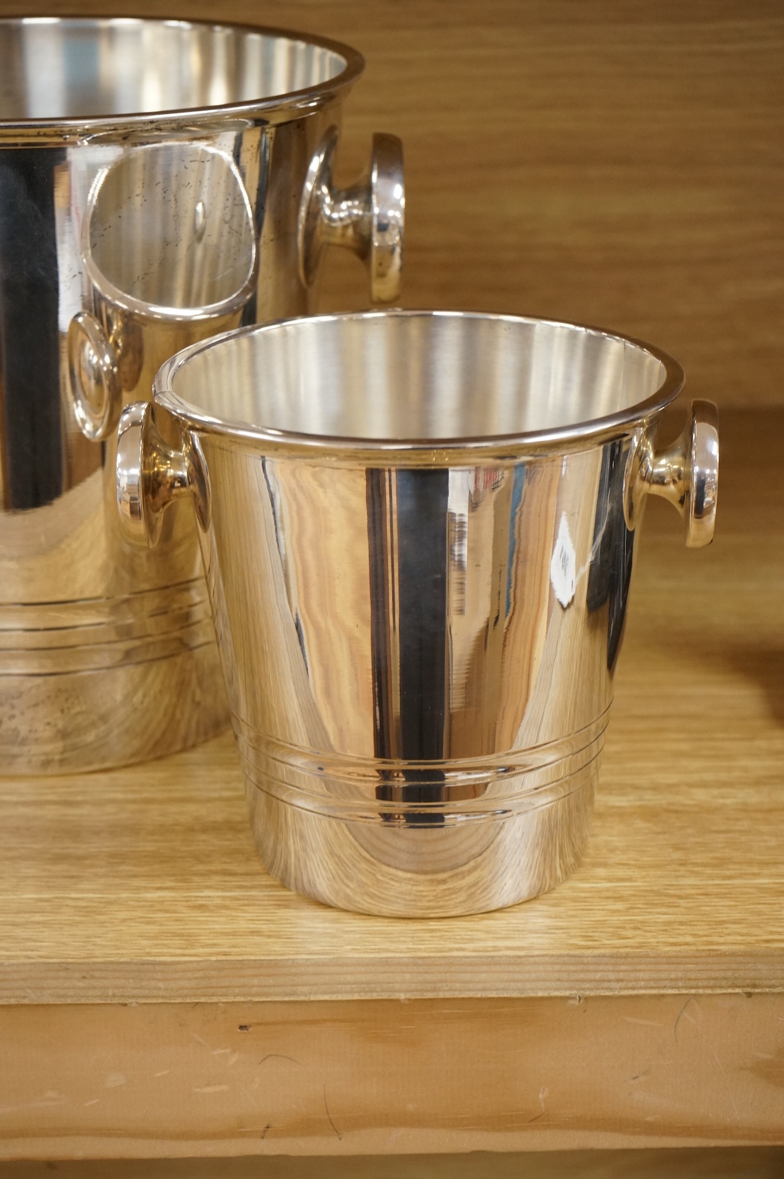 A plated champagne bucket and an ice bucket, St Medard, largest 19cm high